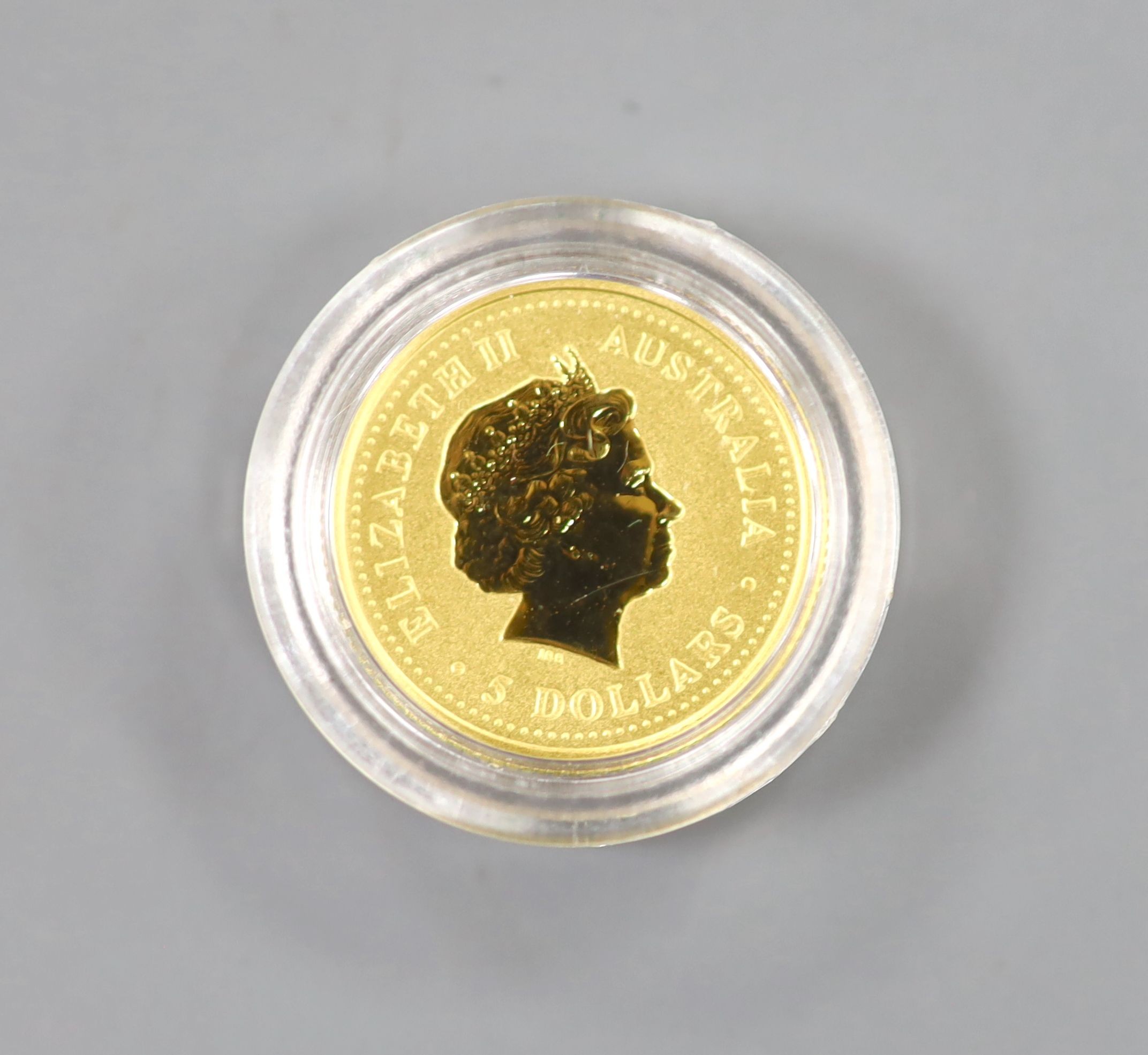 A cased Perth Mint Australian 1/20 oz gold 5 dollar coin.